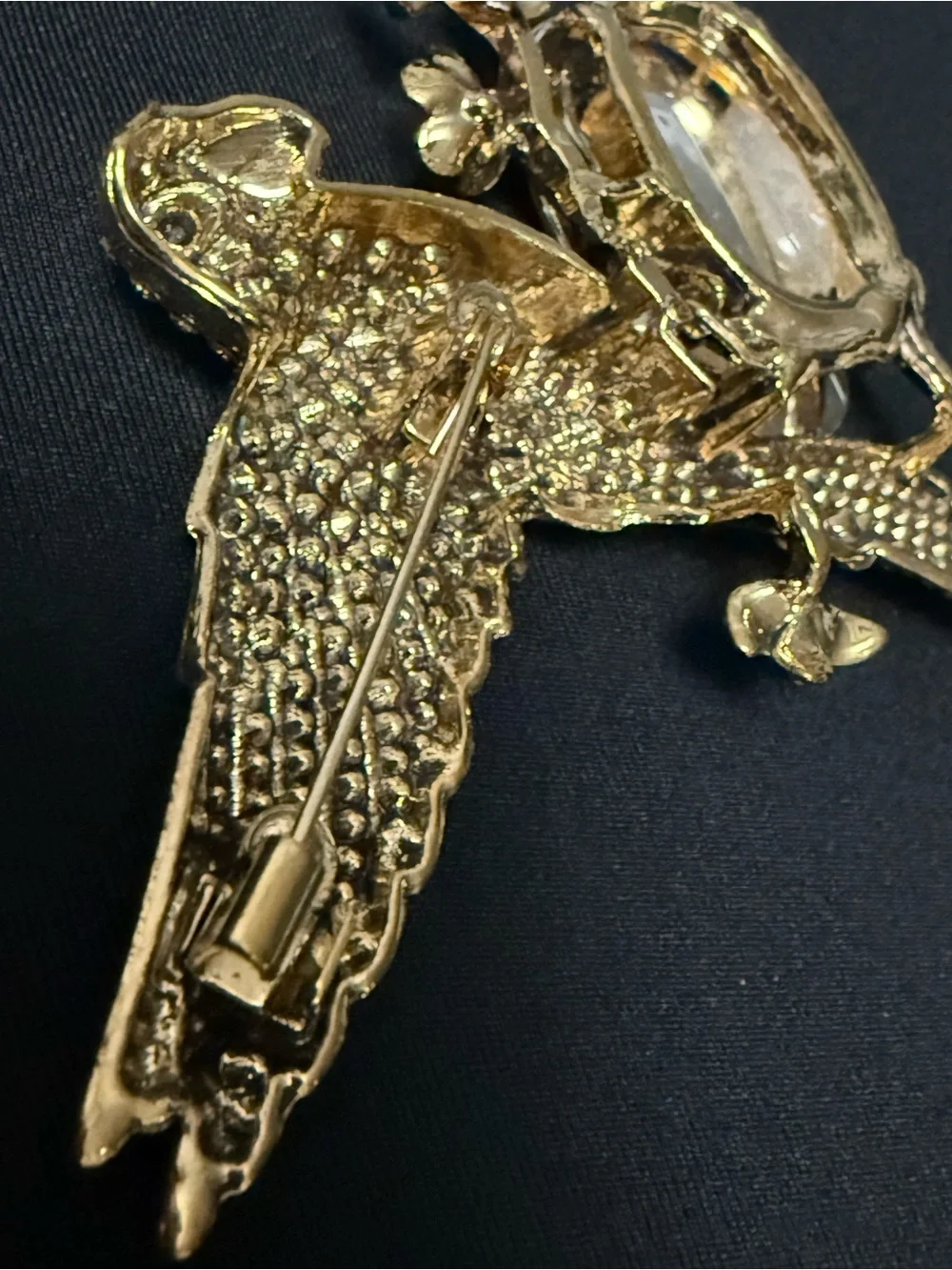 vintage-inspired green crystal parrot brooch with yellow stone